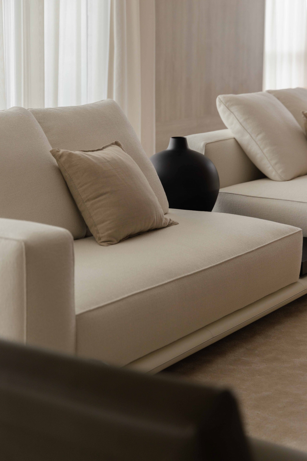 The Minotti sofa anchors the living room in understated, tactile comfort