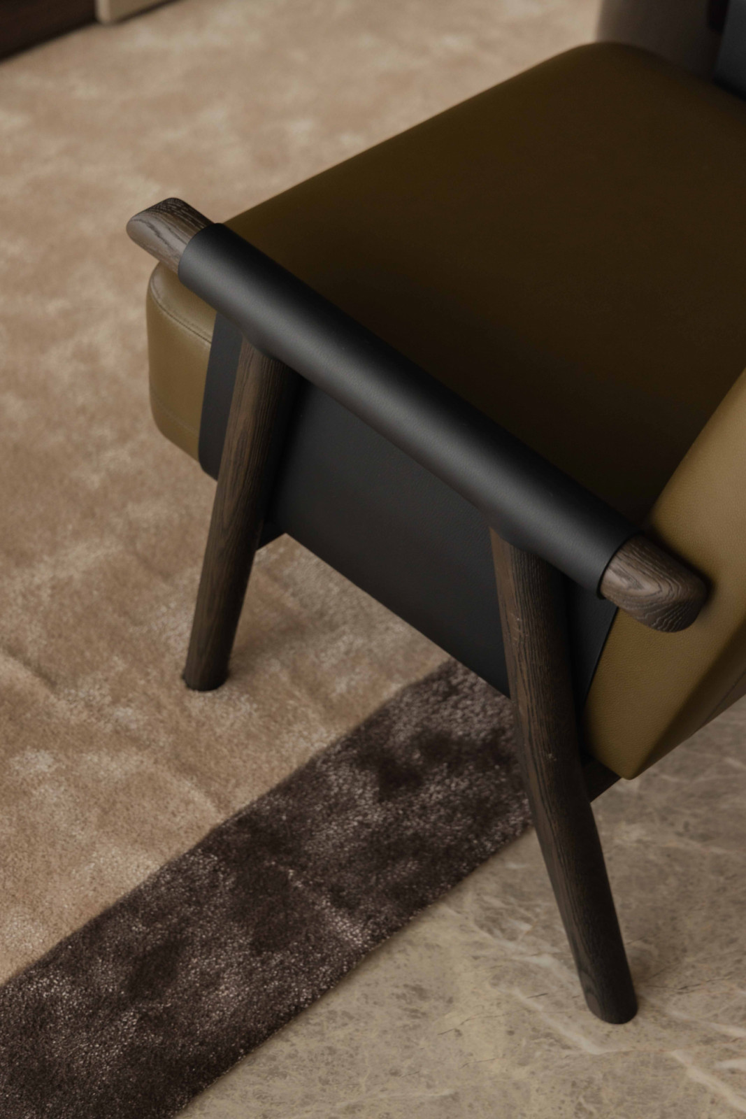 A Christian Liaigre armchair in the living room displays the refined craftsmanship the homeowner admired
