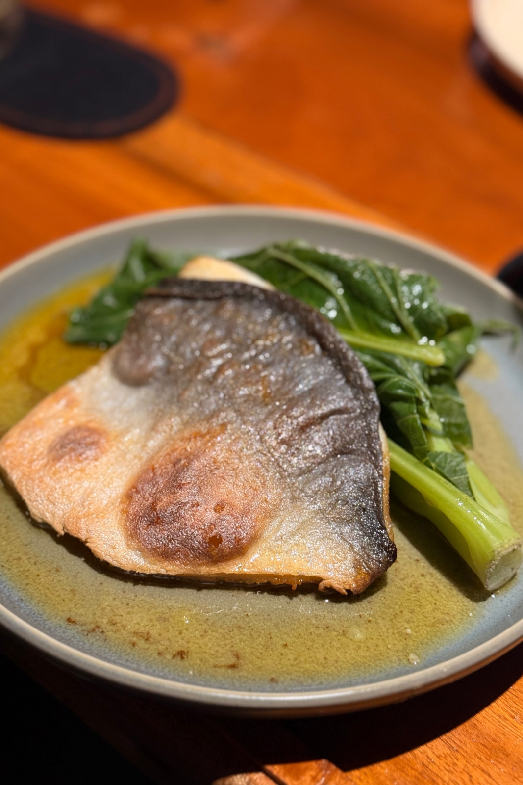Pompano from Toma Toma, served with brown butter, kailan, taomato and calamansi