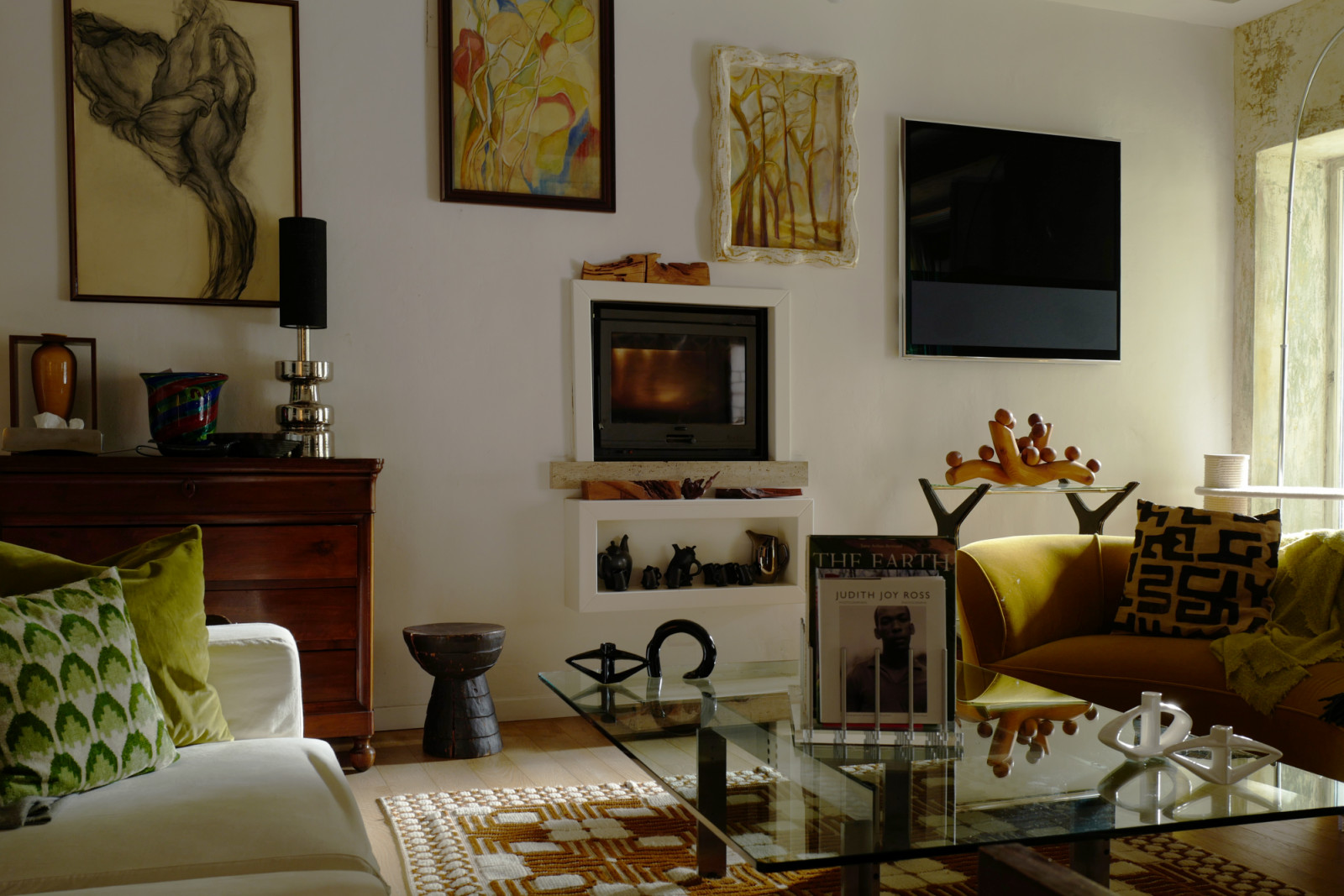 The Milan living room reflects Wolela’s instinctive approach to design, where texture, art and collected objects come together in quiet harmony