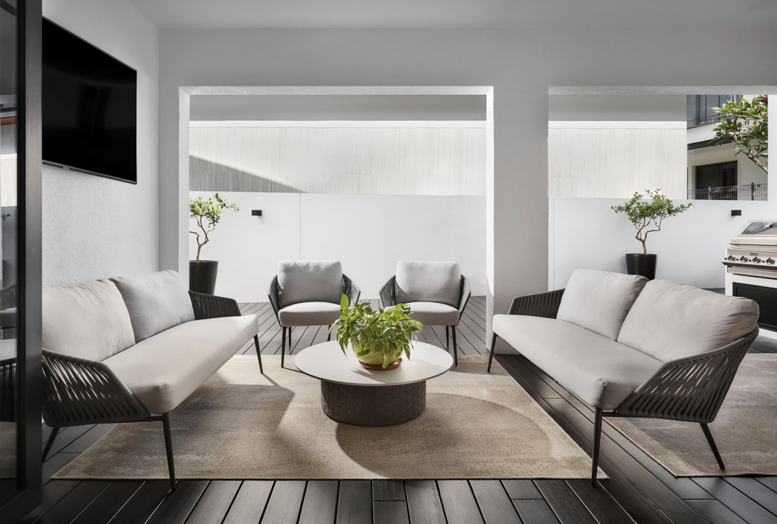 The breakfast and barbecue corner in the home’s inviting backyard