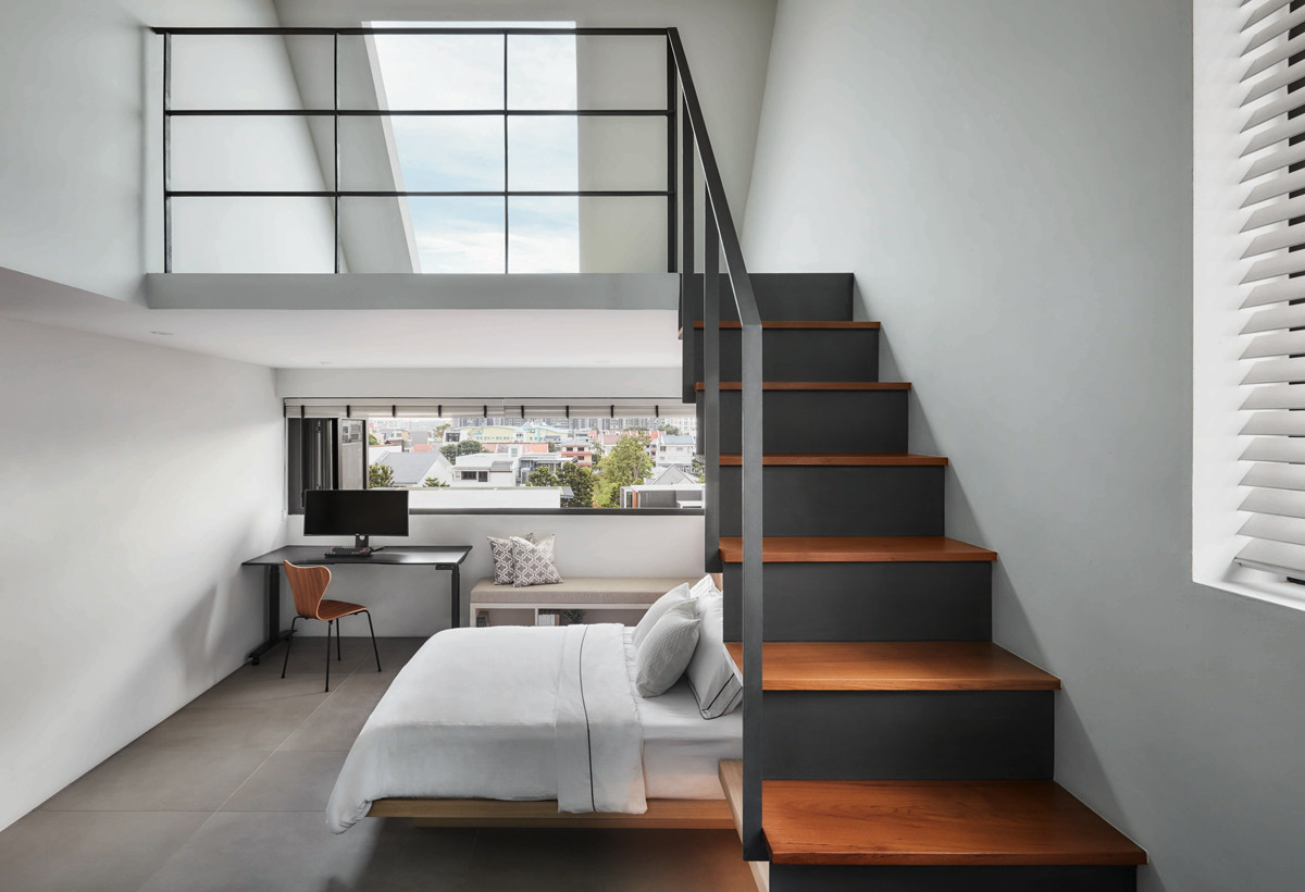 This loft bedroom incorporates both a window and a skylight