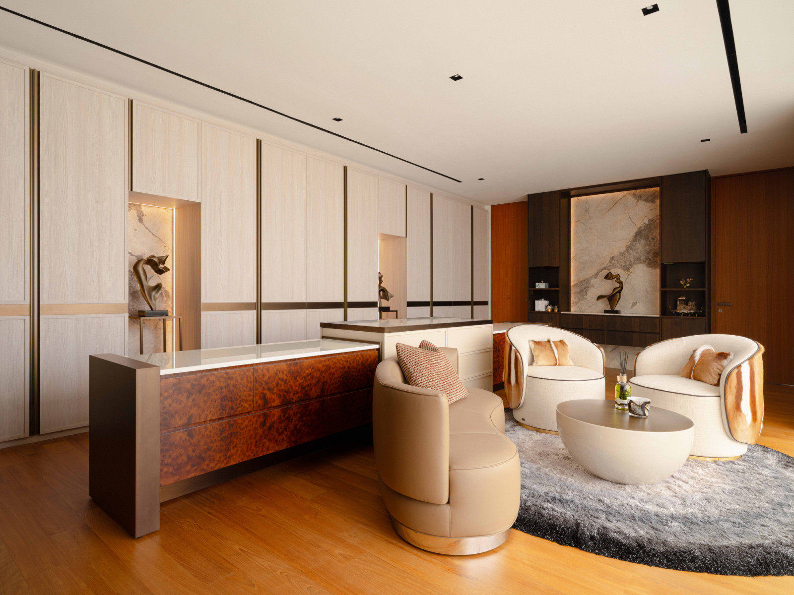The bungalow’s boutique-style walk-in wardrobe lounge centres on a bespoke island, with Fendi Casa Annabelle swivel armchairs and a Patagonia Tourmaline marble feature wall