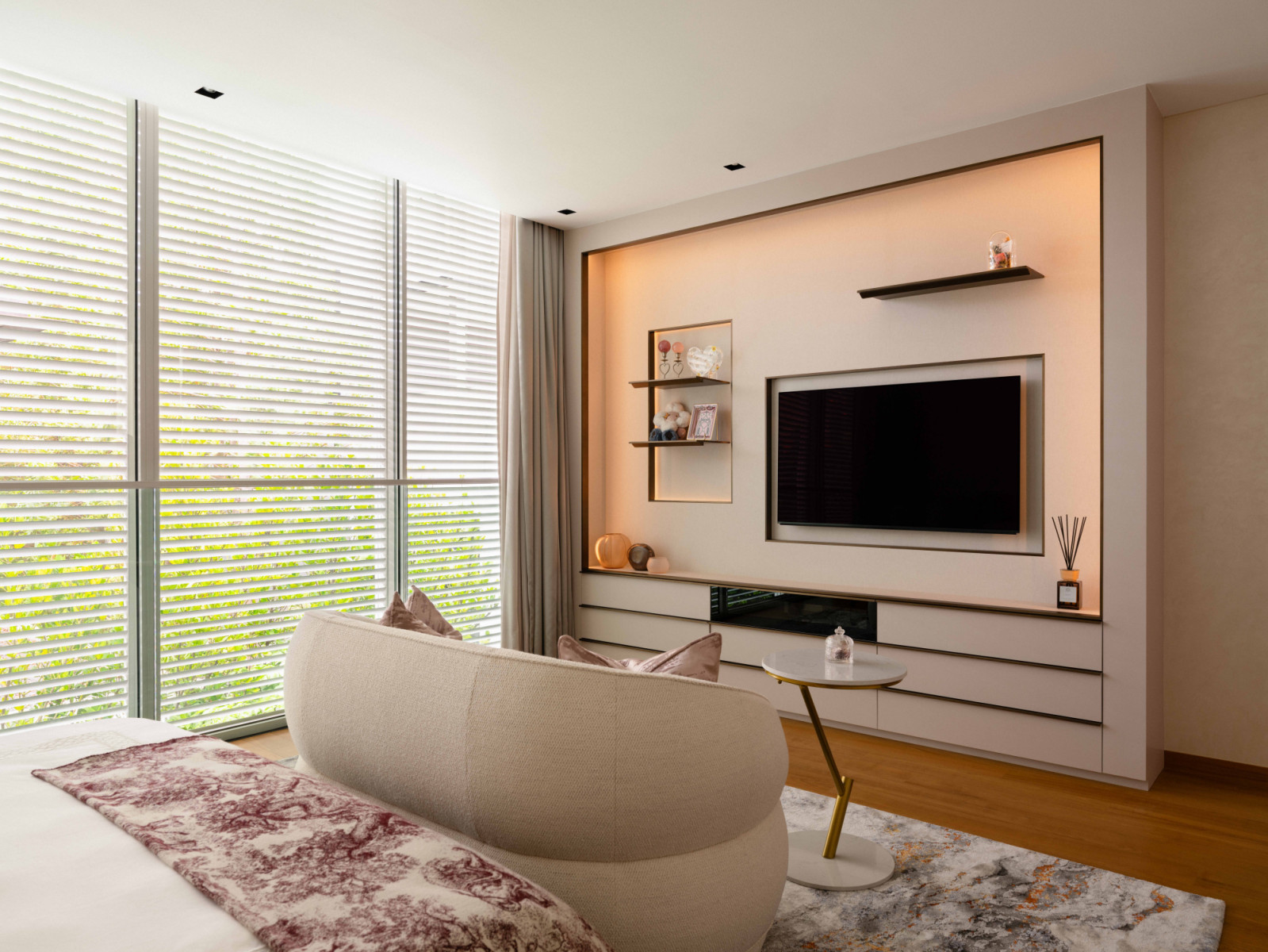 The daughter's bedroom features a bespoke backlit TV wall with personalised display shelving