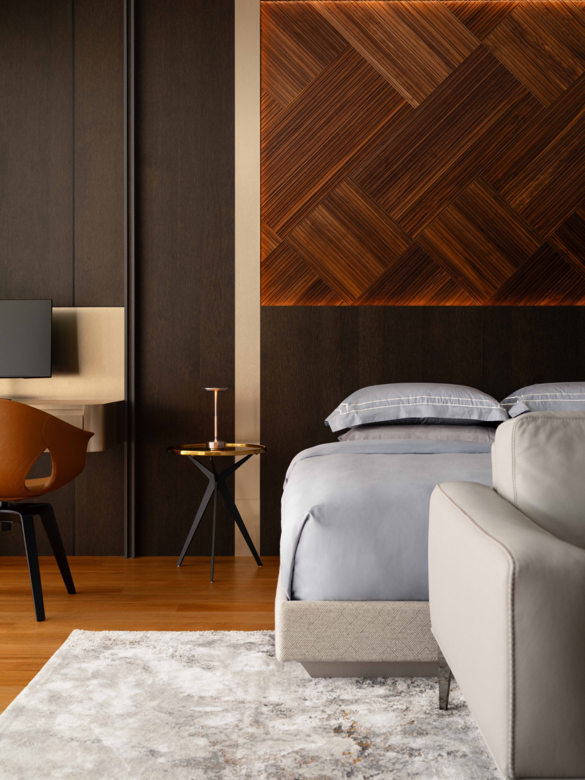 The son's bedroom pairs a woven timber feature wall with a dark, enveloping palette and a built-in study nook