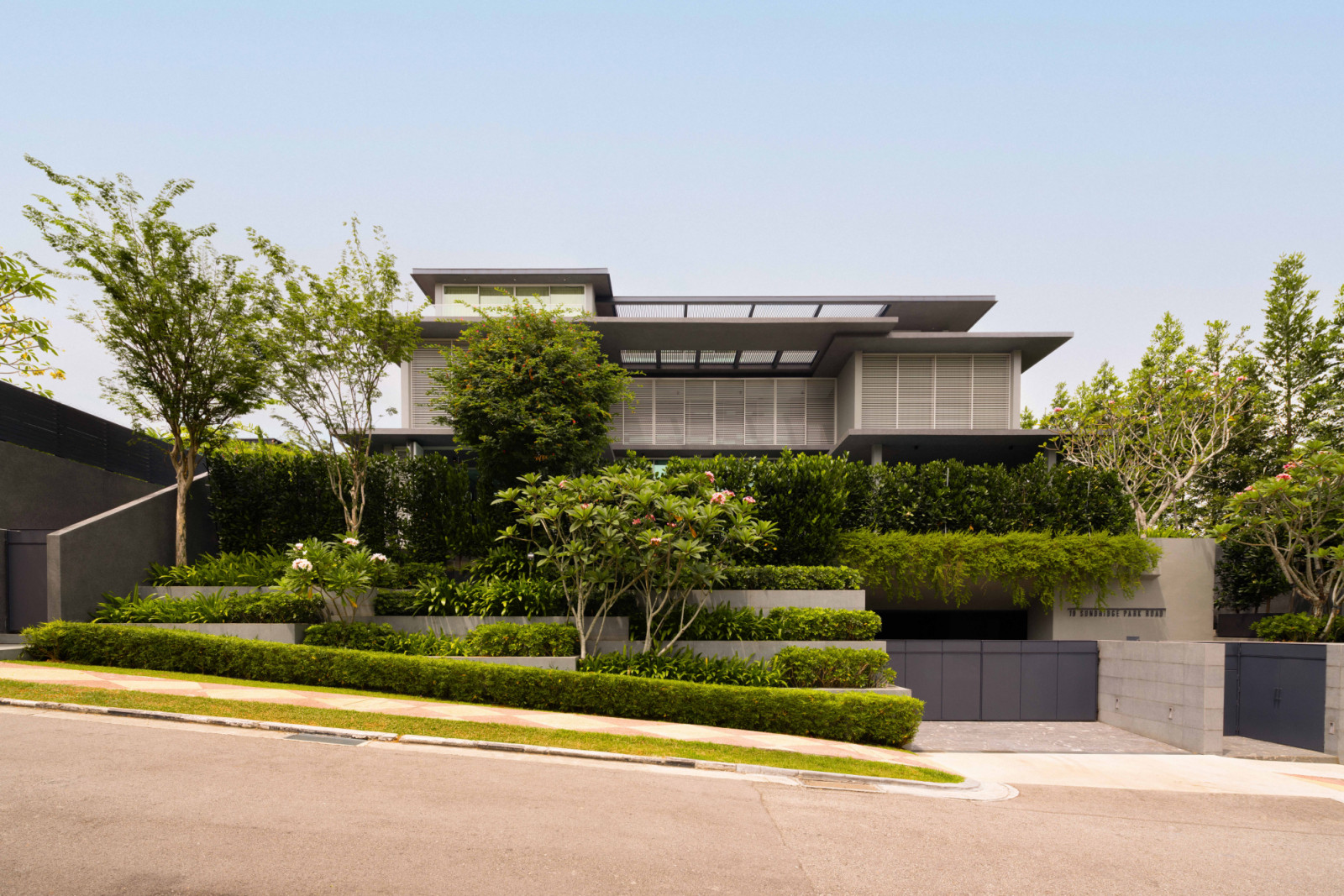 Designworx Interior Consultant transforms the interior of Within The Walls House, a striking, verdant bungalow designed by Park + Associates in District 13
