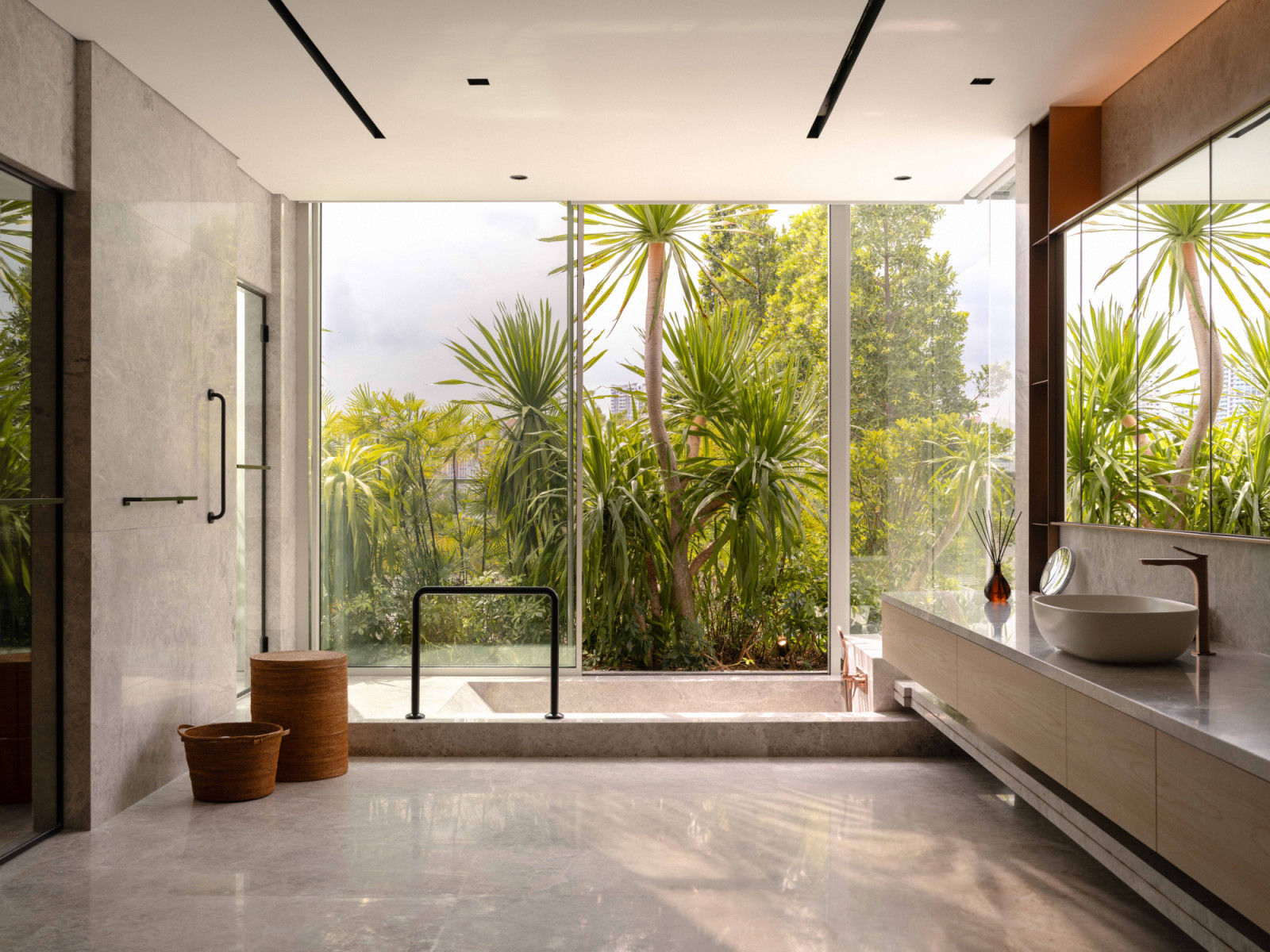 The verdant view from the bungalow’s master bathroom