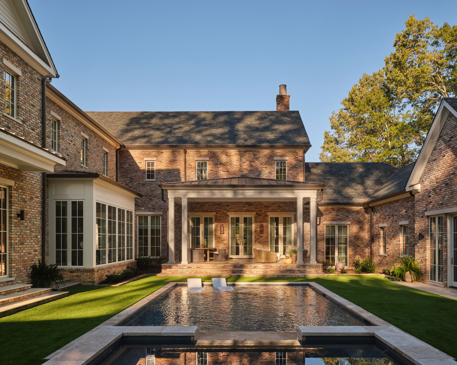 The pool and garden area of a Mississippi home by Claire Thompson Design