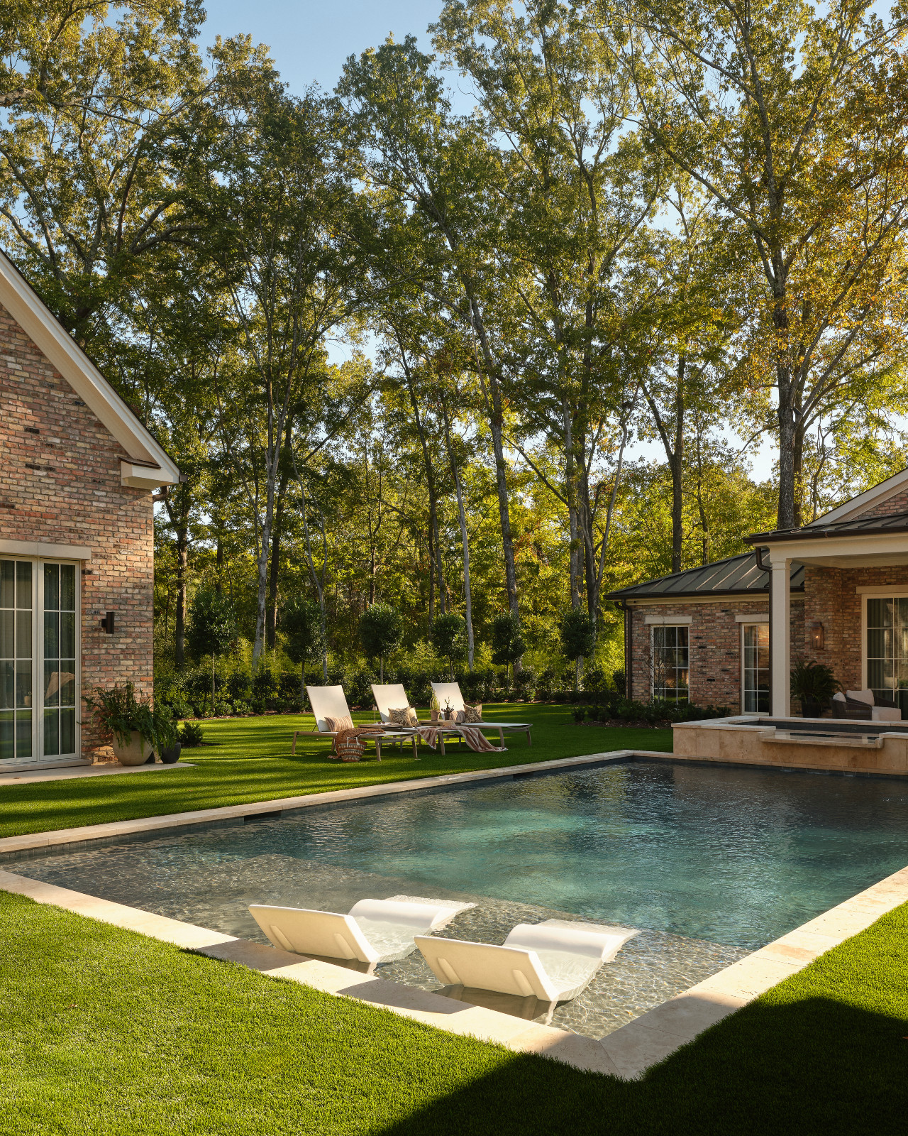 The pool and garden area of a Mississippi home by Claire Thompson Design