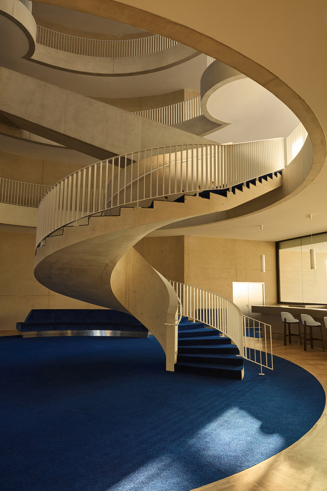 Reflecting 1970s charm with a blend of wood and metal, Biehler Graveleine reimagines the office atrium as a place of connection and dynamic movement