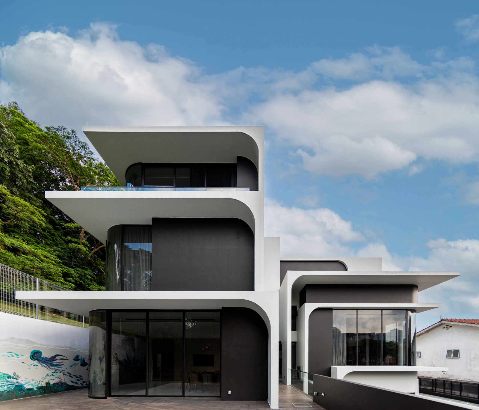 The tiered facade is designed to be reminiscent of tree branches, and the outdoor mural by local artist ShareD’s Art features flora and fauna inspired by the Genesis creation story