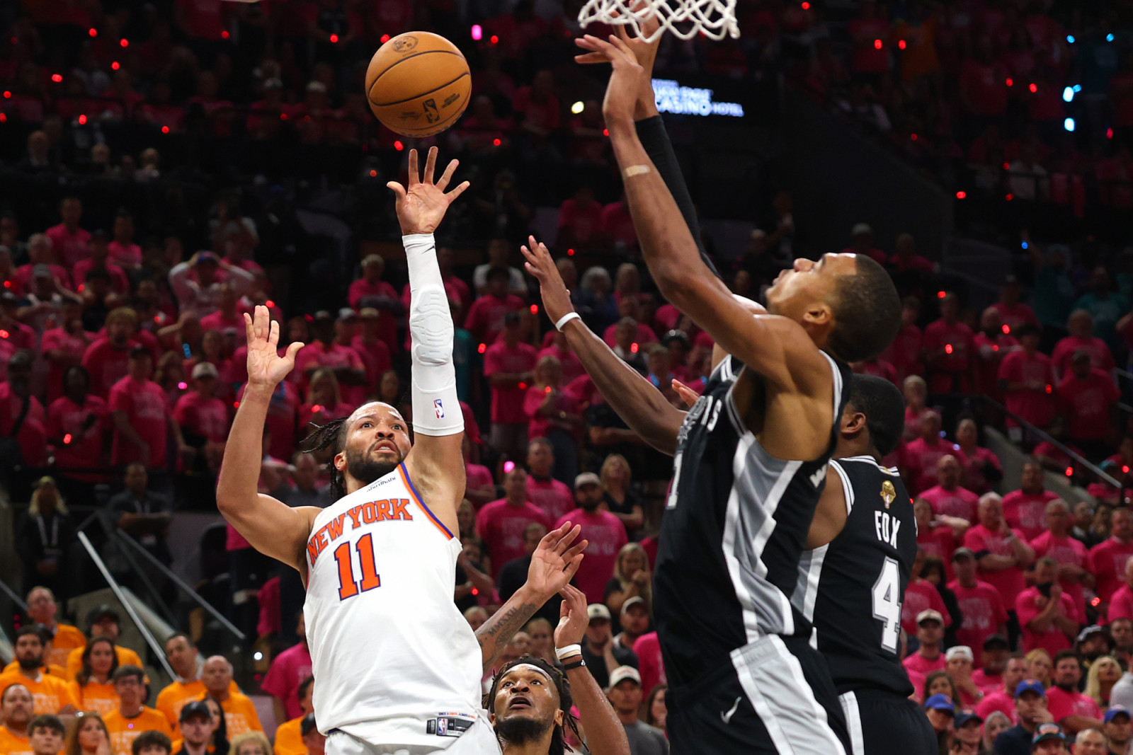 SAN ANTONIO, TEXAS - JUNE 03: Jalen Brunson #11 of the New York Knicks shoots the ball against Victor Wembanyama #1 and De'aaron Fox #4 of the San Antonio Spurs during the fourth quarter in Game One of the 2026 NBA Finals at Frost Bank Center on June 03, 2026 in San Antonio, Texas. NOTE TO USER: User expressly acknowledges and agrees that, by downloading and or using this photograph, User is consenting to the terms and conditions of the Getty Images License Agreement. (Photo by Gregory Shamus/Getty Images)