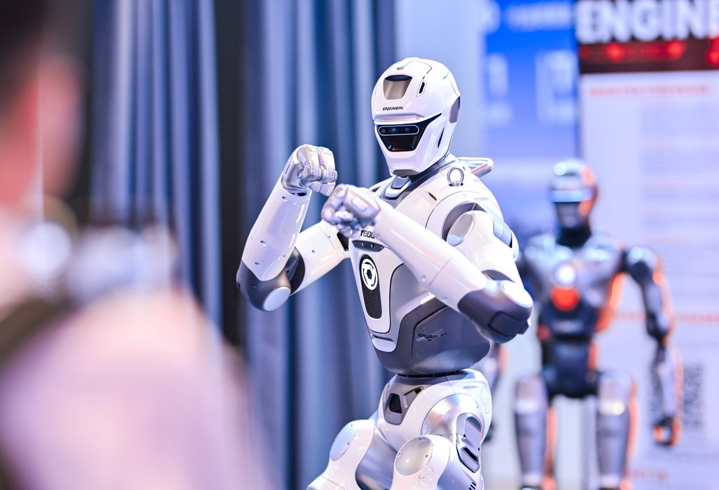 An EngineAI humanoid robot takes a fighting stance. EngineAI was one of many VC-backed startups exhibiting their latest models at Beyond Expo 2026. (Photo: Beyond Expo)