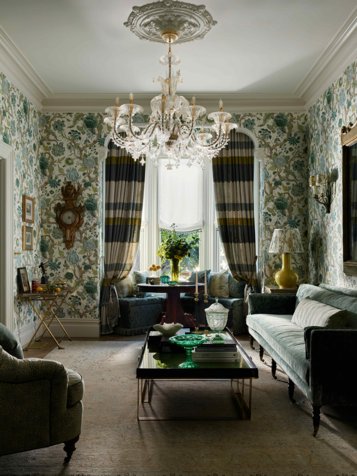 The formal living room anchored by a bay window