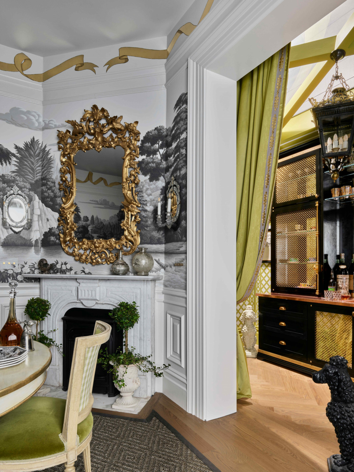 Separated by a portière is a sun room previously added by the homeowner