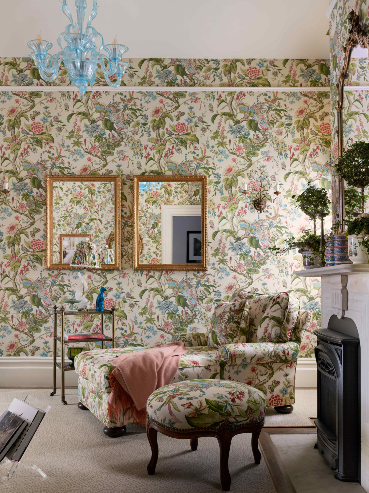 The personal parlour wrapped in English-style chintz wallpaper and Schumacher fabric