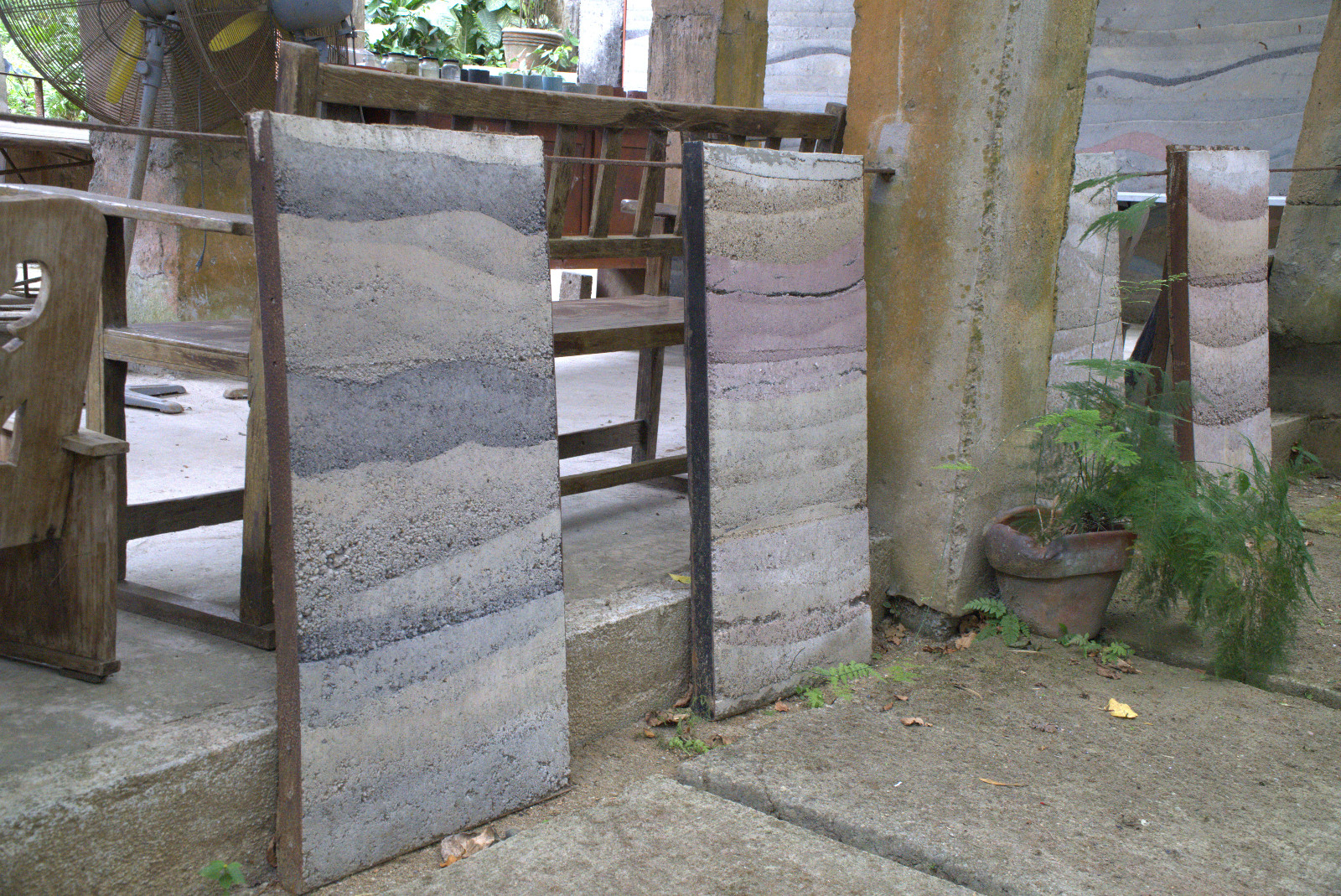 A pair of early experimental rammed earth slabs