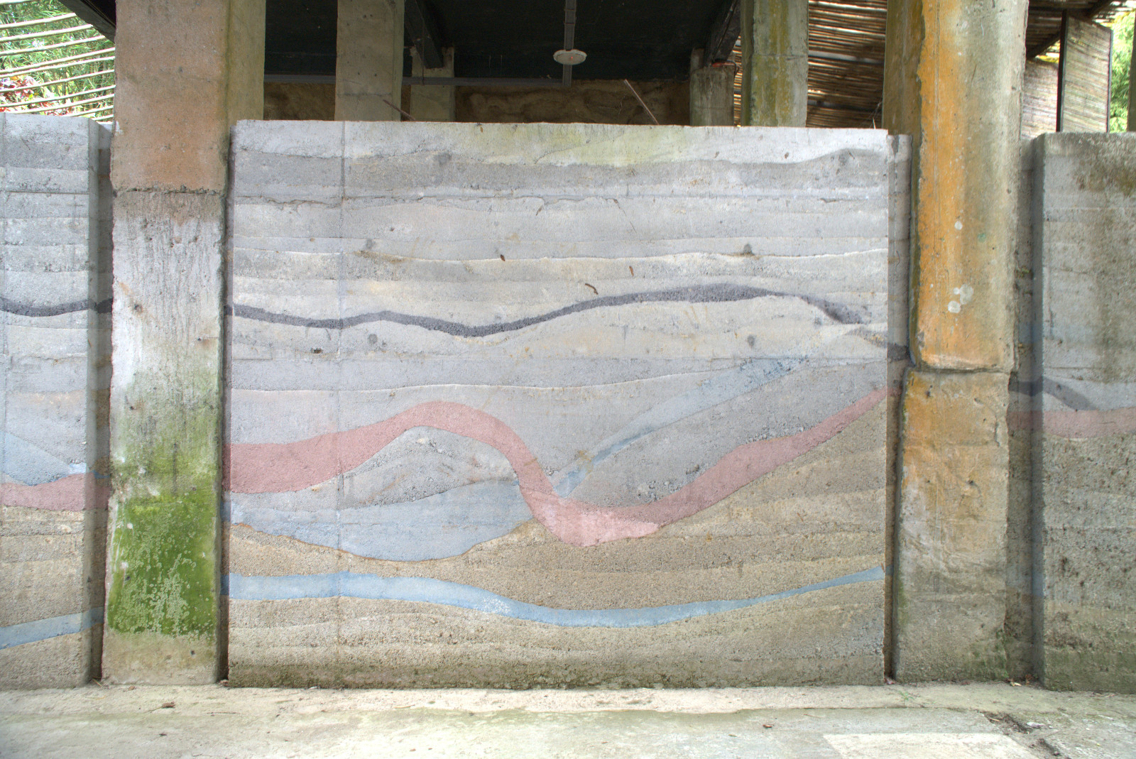 A horizontal rammed earth slab