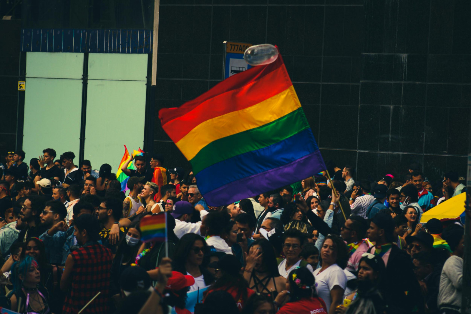 A lively crowd celebrating at a Pride parade (Photo: Pexels)