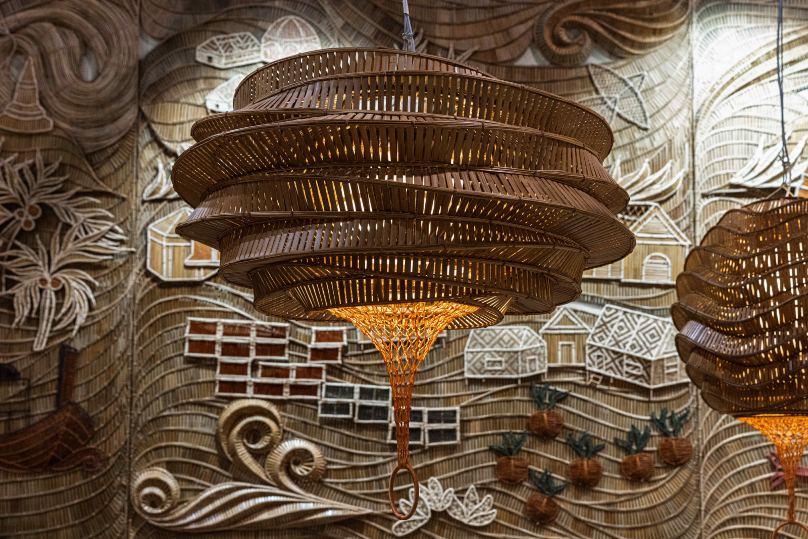 The knot-tying bamboo sculptures breathe with the shifting light