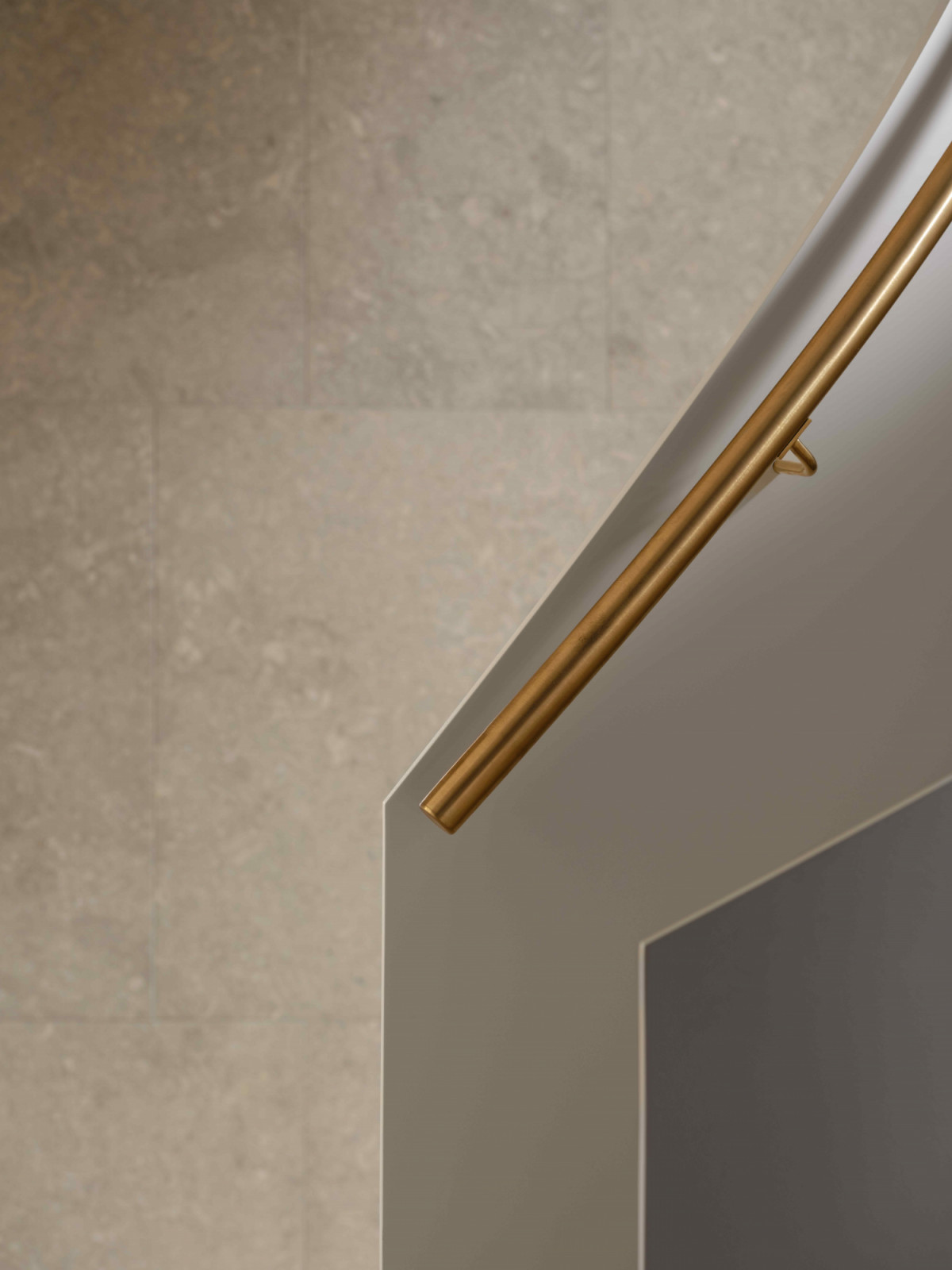 The slender balustrade with a solid bronze handrail