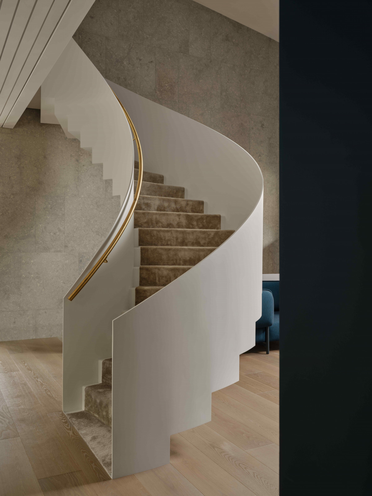 The new, dramatic curved staircase in the grand foyer