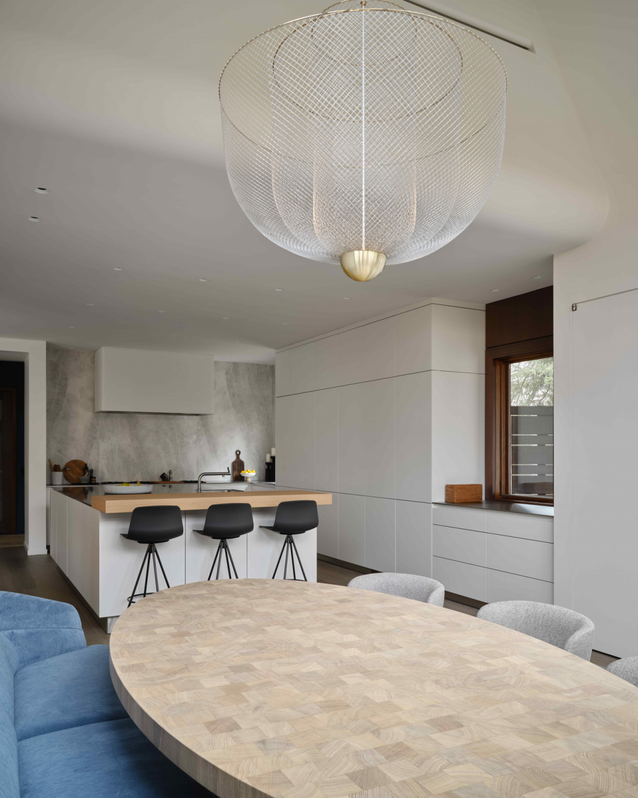 A breakfast nook tucked away just beyond in the open-plan kitchen
