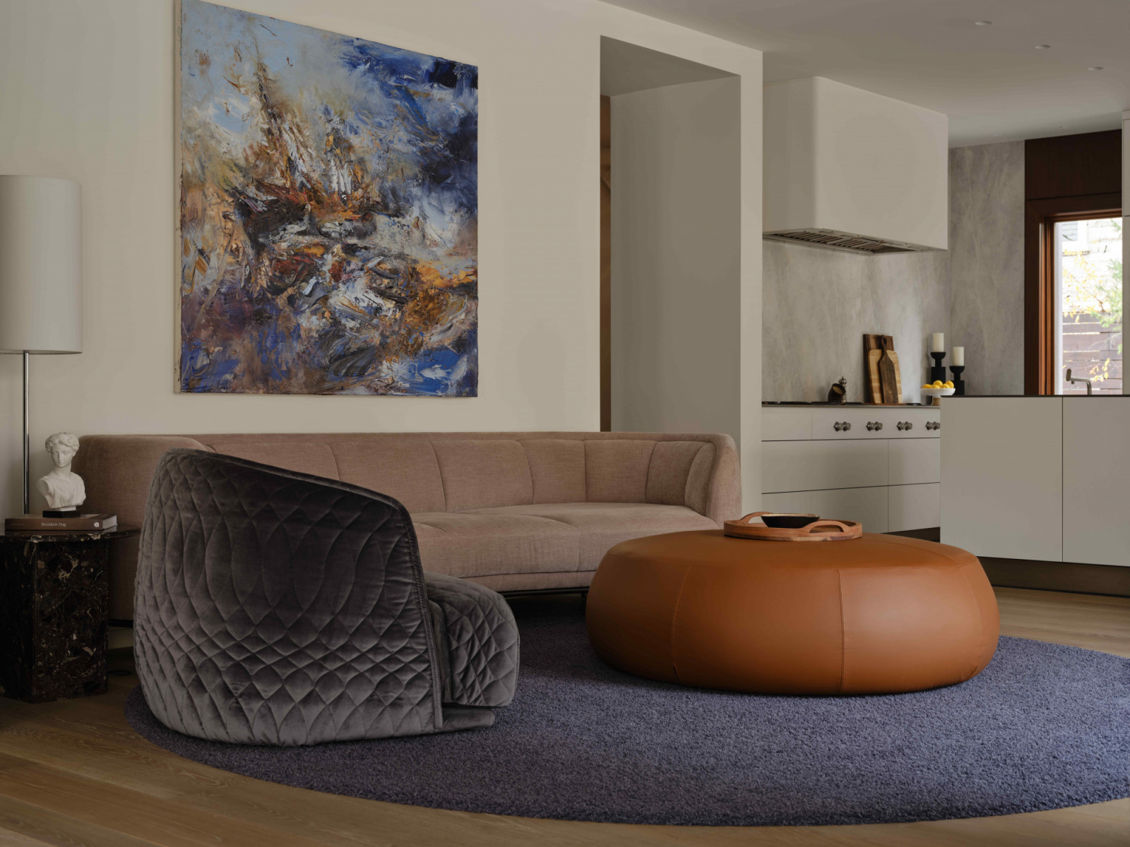 The secondary seating area with darker, richer-hued furnishings