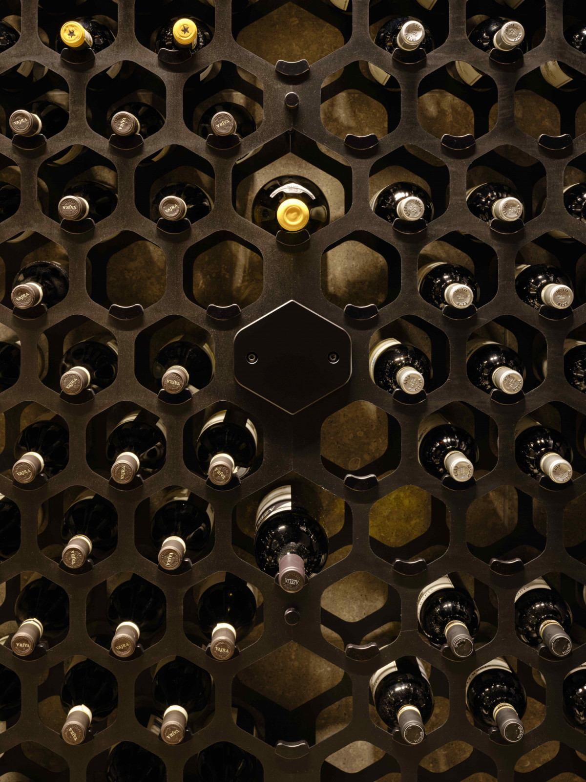 A custom oil-rubbed steel-rack system introduces tactility