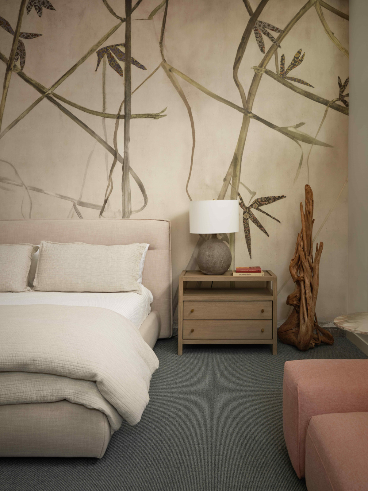 The bedroom in the pool house with a nature-inspired theme