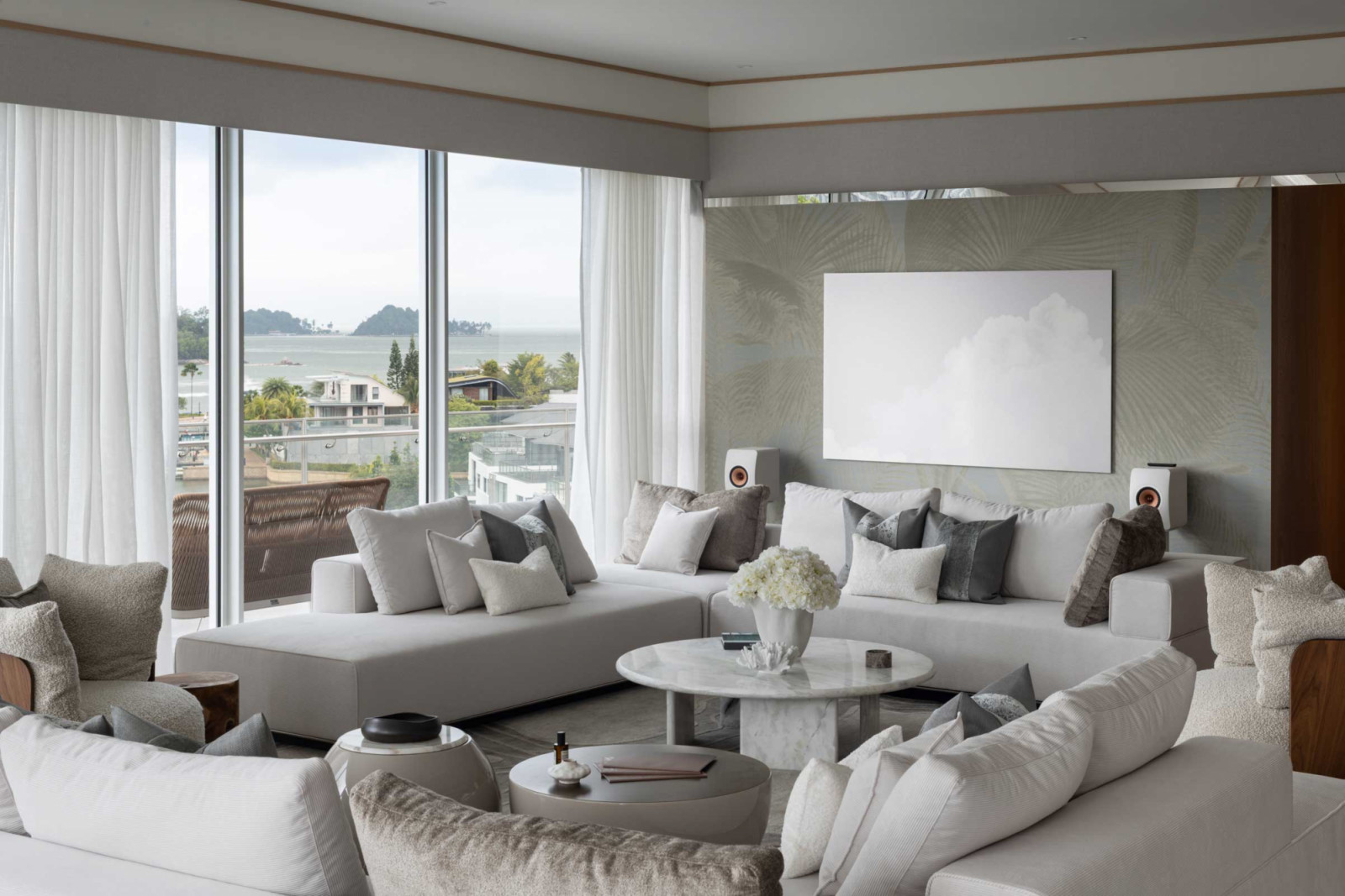 A green wallcovering and wavy lines on the custom rug reference the waves outdoors