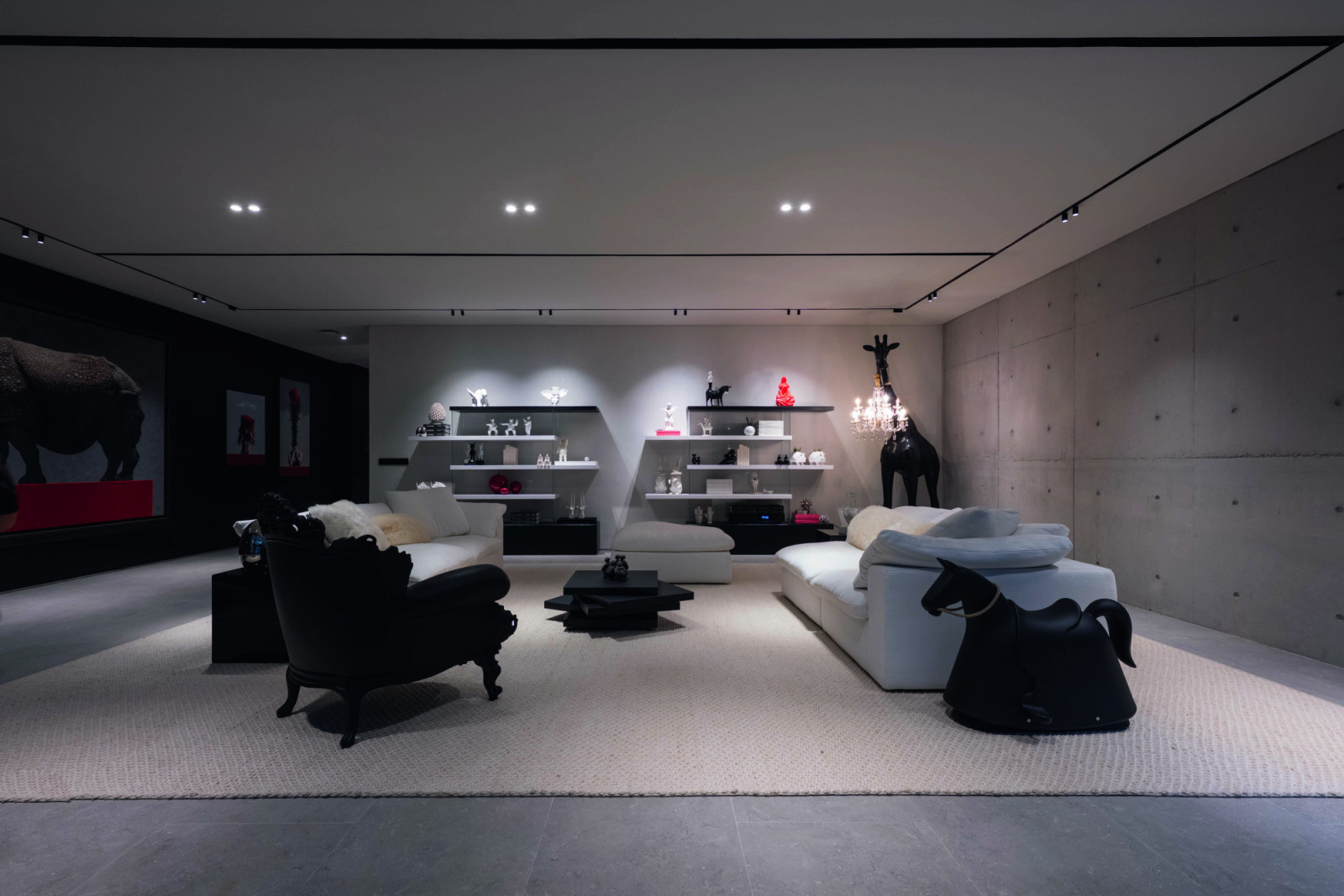 Animal motifs enliven a sitting area in black and white with red accents