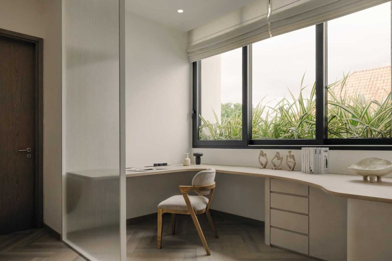 A slim floating desk maximises the use of space in the study
