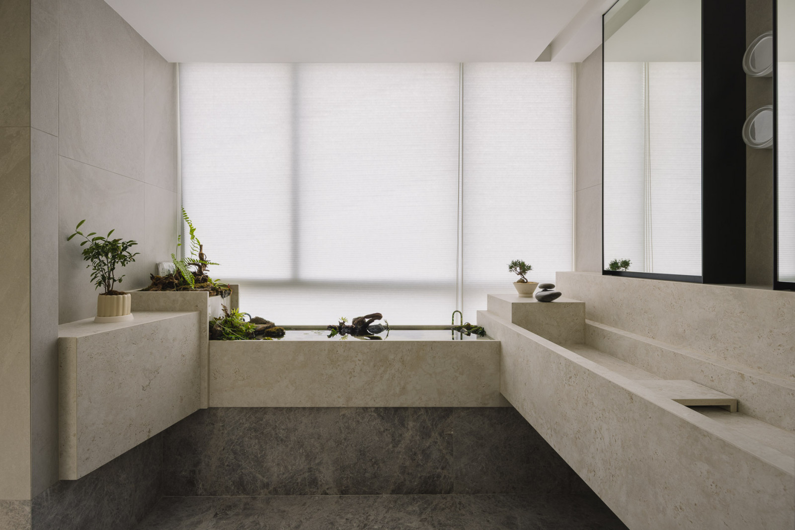 Filtered daylight infuses this bathroom with an airy feel and details evoke images of a Zen garden