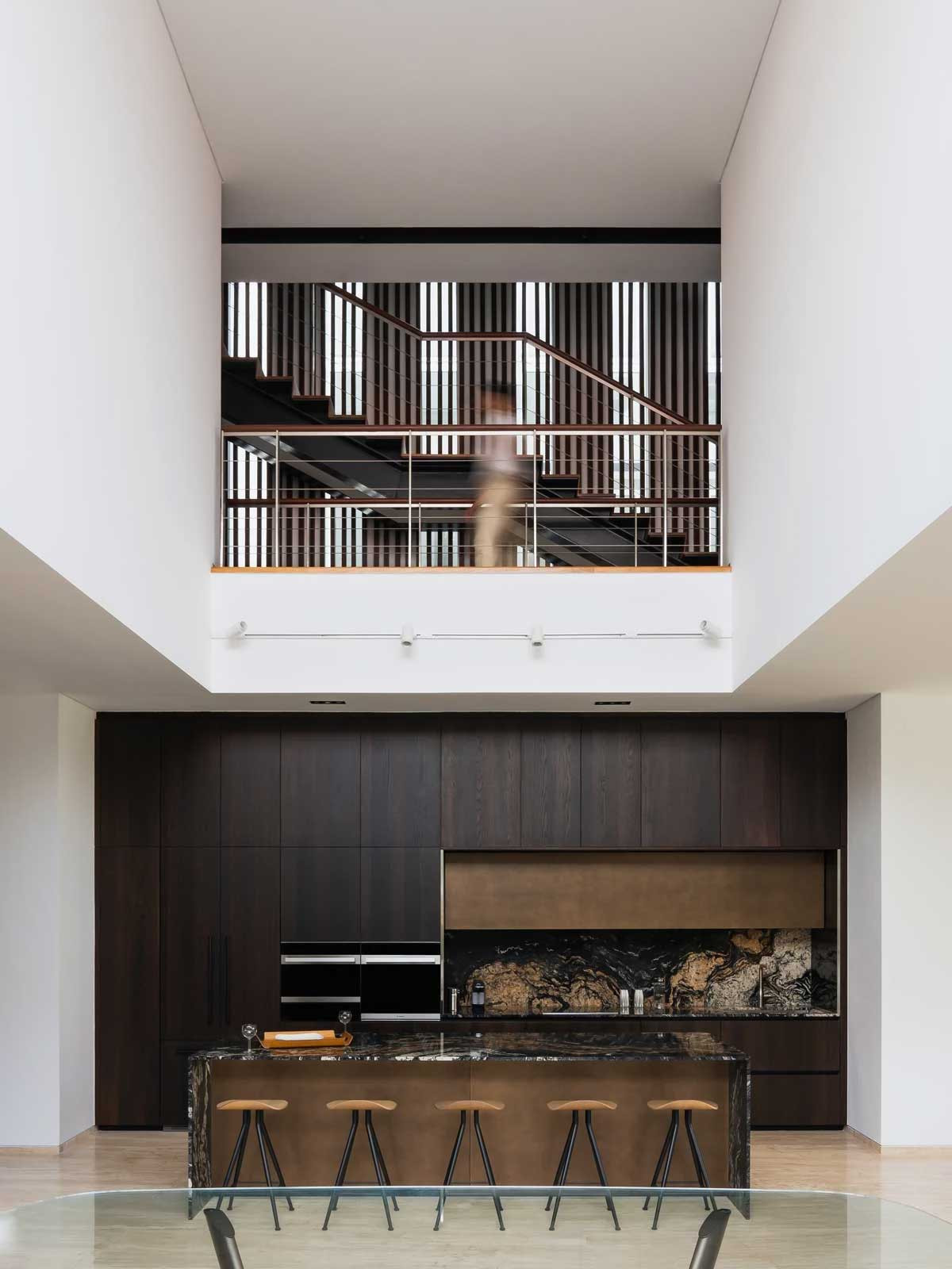 The double-volume ceiling lends drama to the dining space