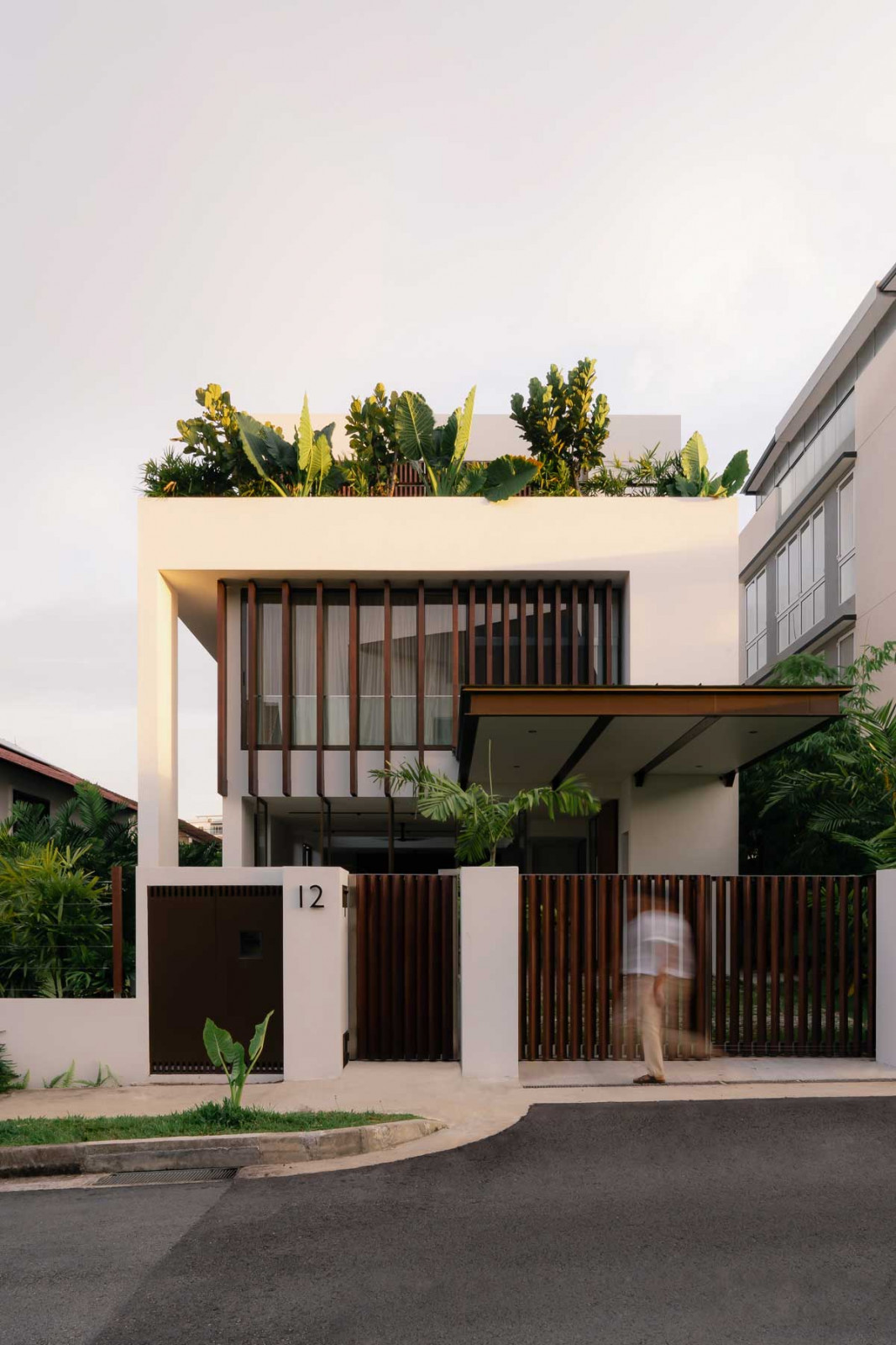 The 7,800 sq ft White House stands quietly amid lush foliage