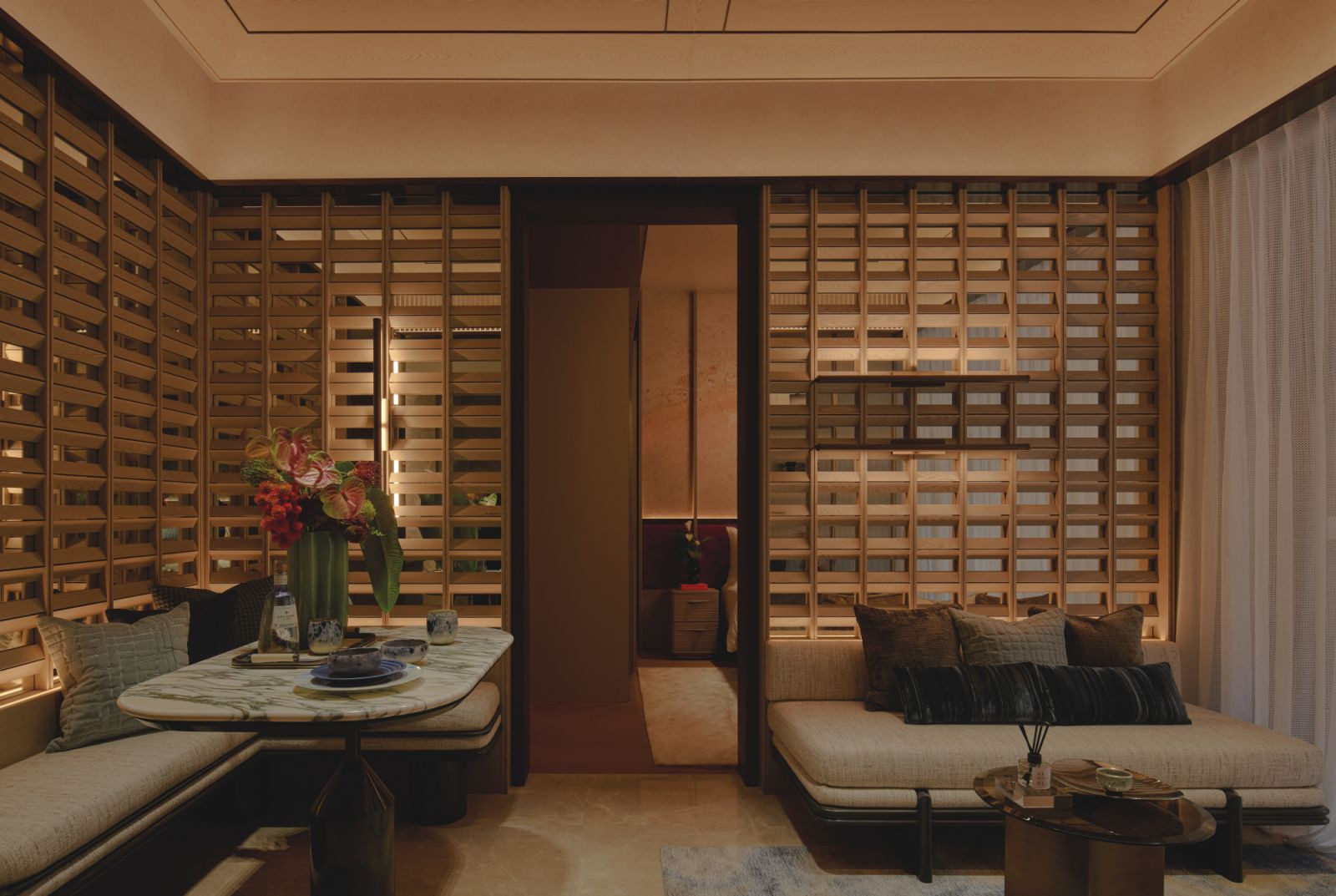 A three-dimensional timber feature anchors the living space, offering both visual privacy and a lightness that invites natural flow between zones