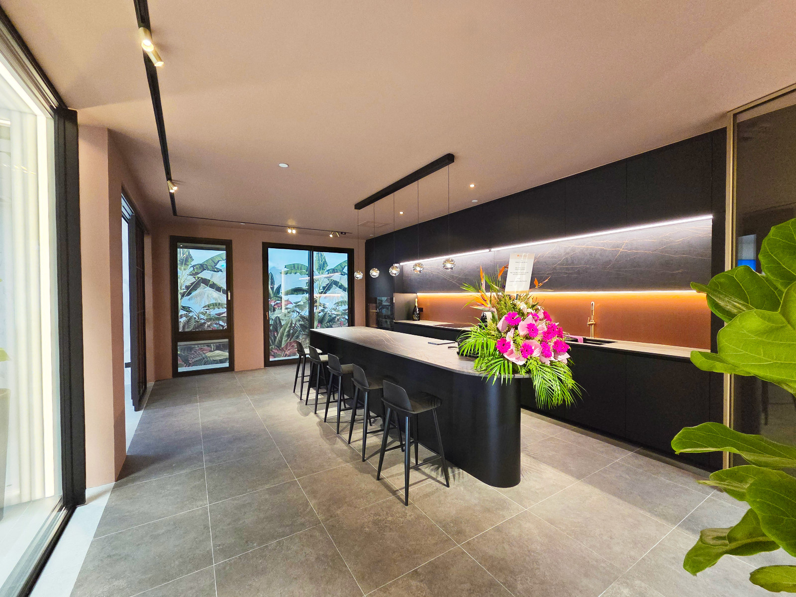 The kitchen area is separated from the rest of the showroom with large sliding doors