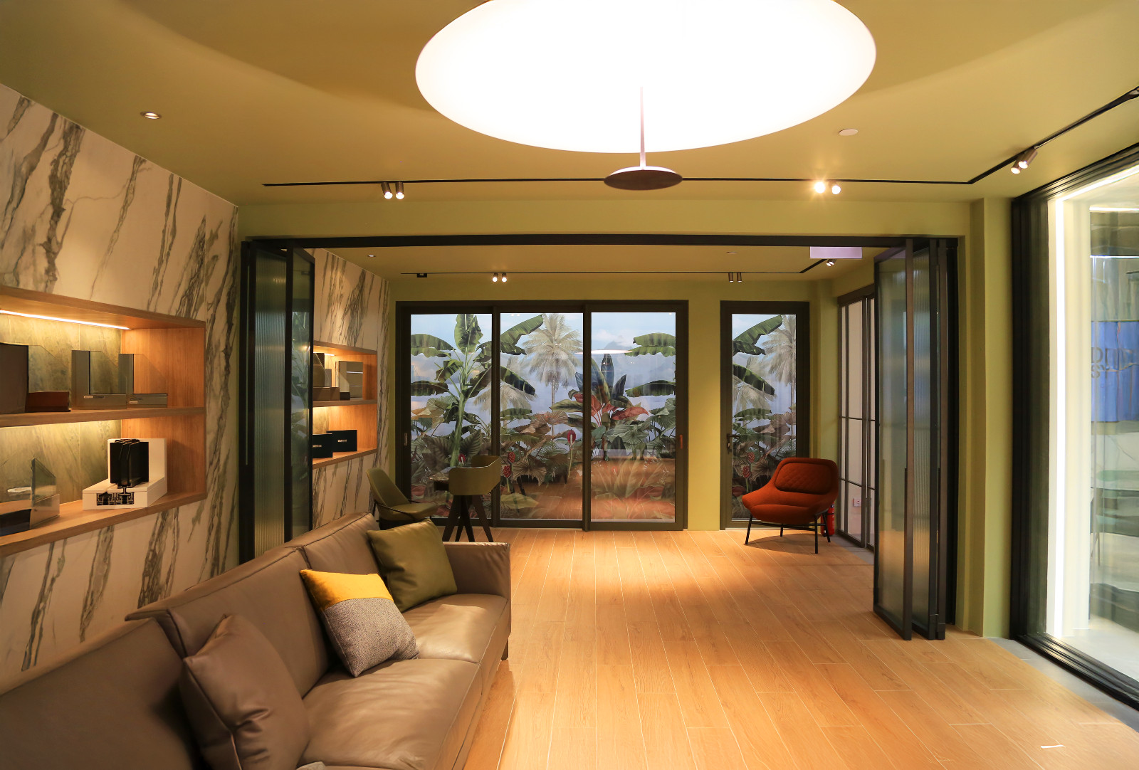 This area of the showroom is styled to resemble a living room next to a patio