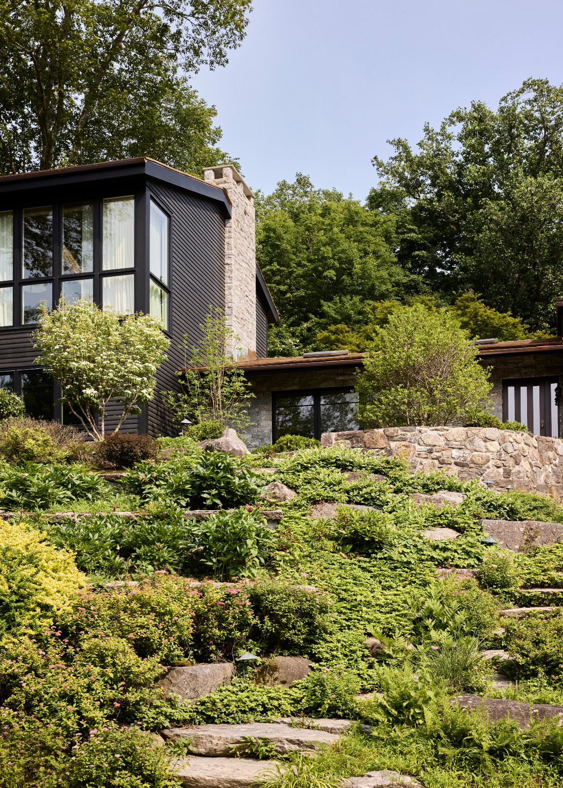 The exterior of a family home in Westport, Connecticut designed by The 1818 Collective