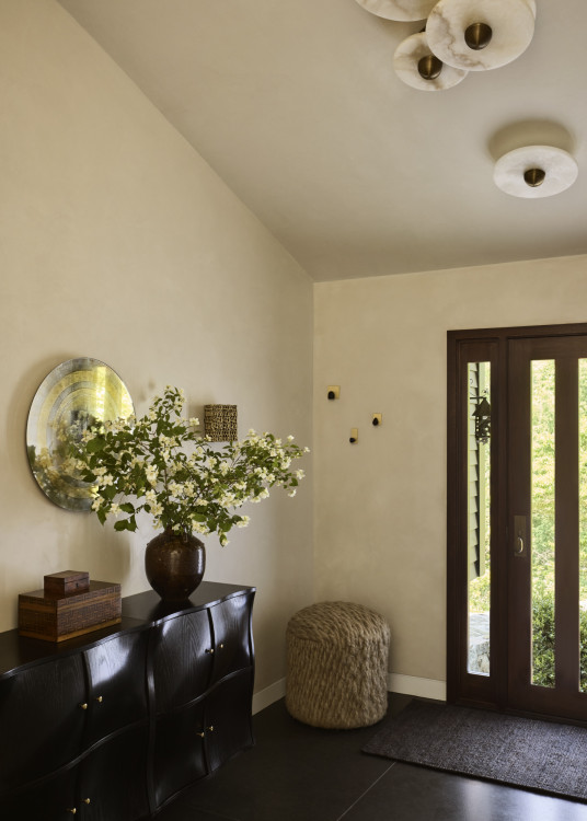 The entryway of a family home in Westport, Connecticut designed by The 1818 Collective