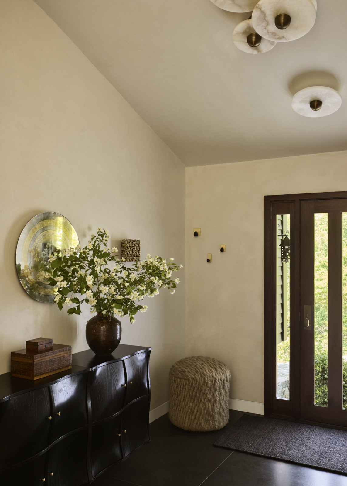 The entryway of a family home in Westport, Connecticut designed by The 1818 Collective