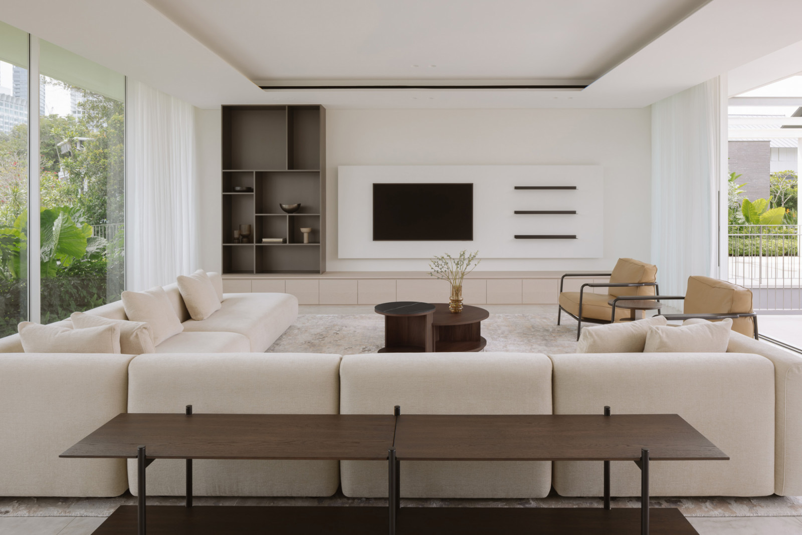 Light drifts across polished stone, rich timber, and textured surfaces, creating the perfect setting for hosting friends