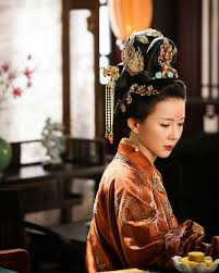 Dowager Xue views every relationship through the lens of long-term family strategy, making her one of the most quietly dangerous figures in the room