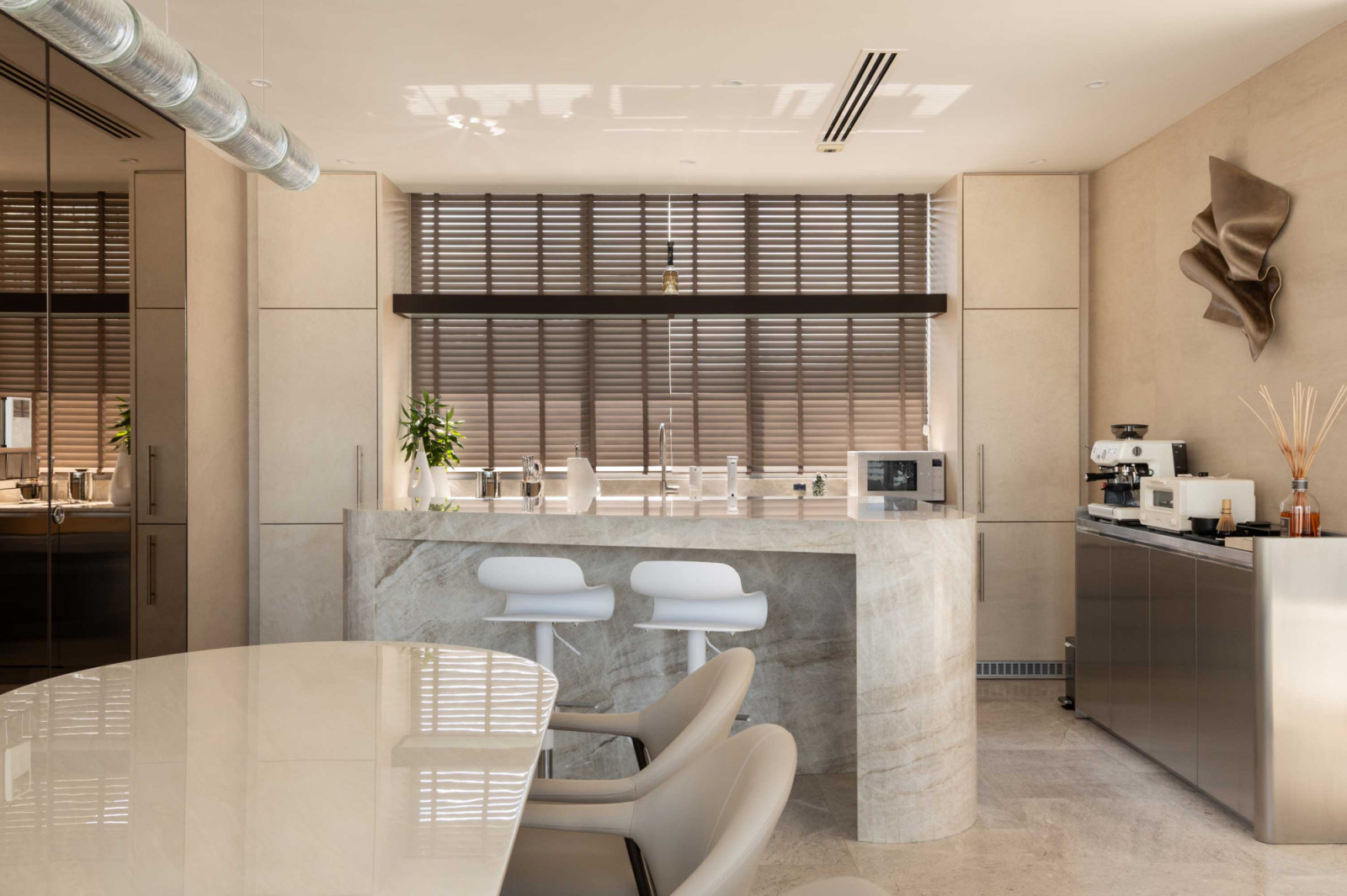A Taj Mahal marble island anchors the kitchen