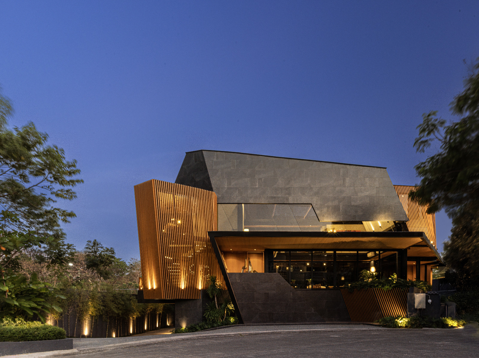 Innovative architectural forms and atmospheric lighting frame the Halcyon House in Alabang, Manila by Barchan + Architecture