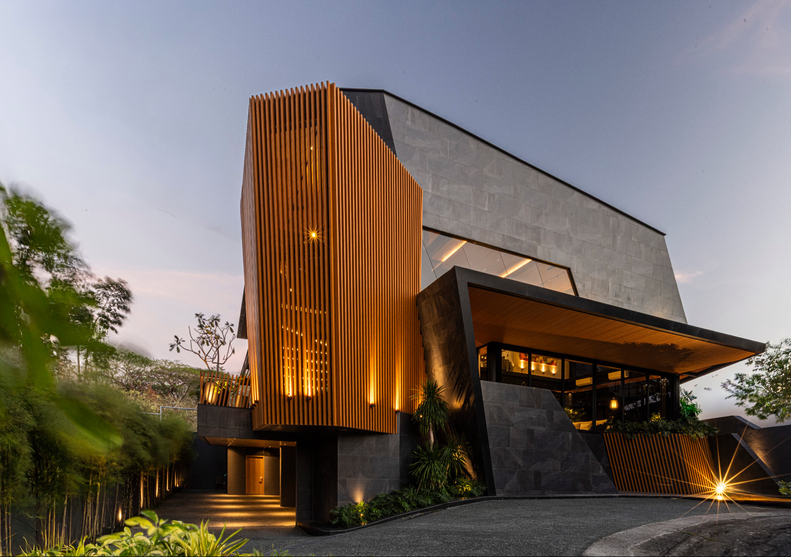 Innovative architectural forms and atmospheric lighting frame the Halcyon House in Alabang, Manila by Barchan + Architecture