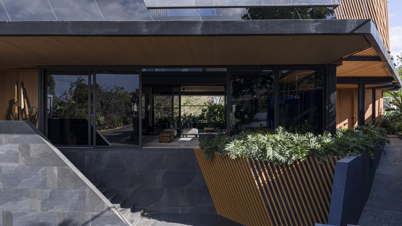 Ventilation and exquisite material forms permeate the Halcyon House in Alabang, Manila by Barchan + Architecture