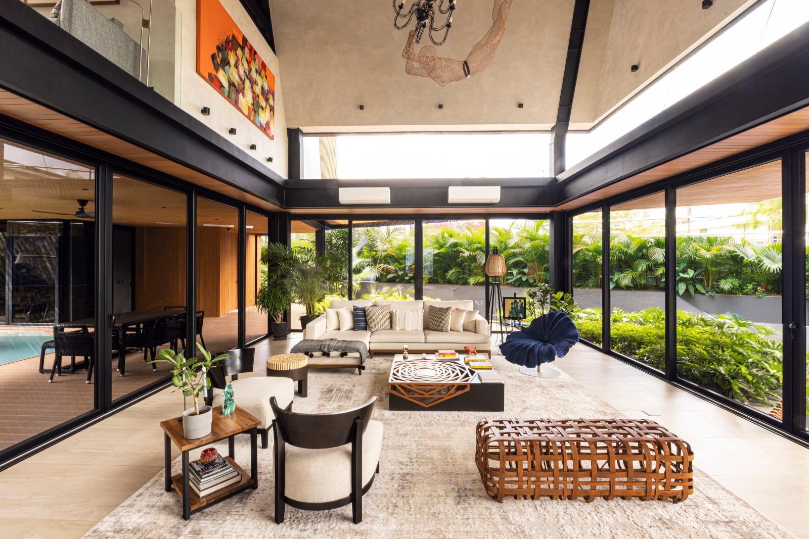 The vibrant living room of the Halcyon House in Alabang, Manila by Barchan + Architecture