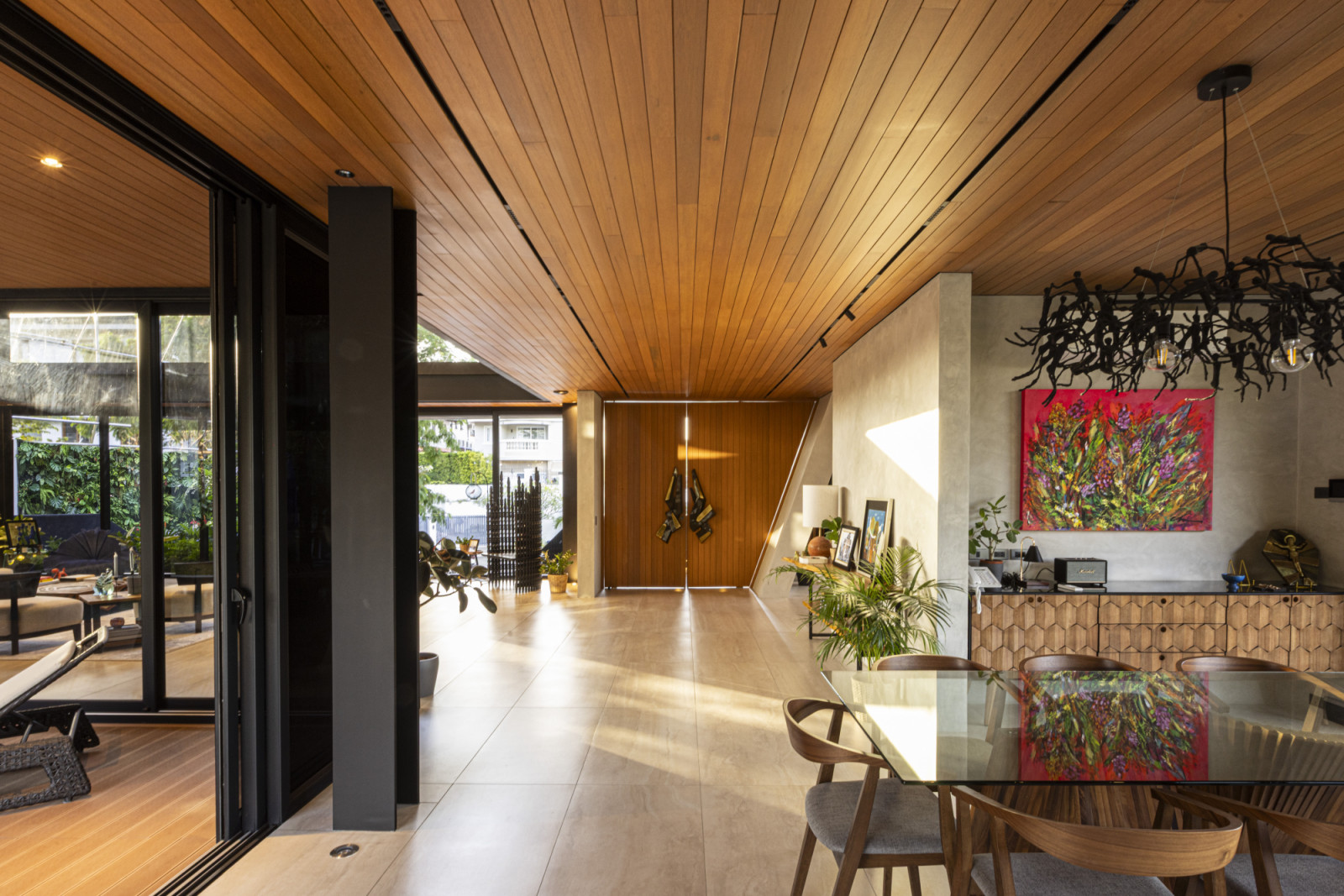 The entryway and dining room of the Halcyon House in Alabang, Manila by Barchan + Architecture